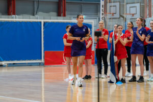 Ally Howitt walking up to receive her Player of the Tournament Award at Europe Netball U17 Championships